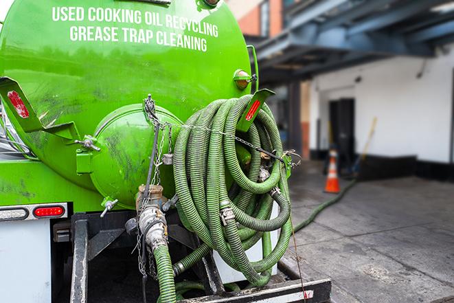 pumping out grease trap at commercial kitchen in East Orange